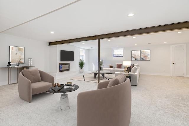 carpeted living area featuring recessed lighting and baseboards