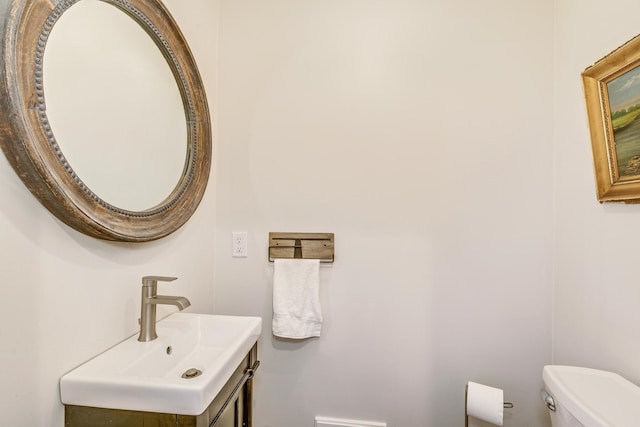 bathroom with toilet and vanity