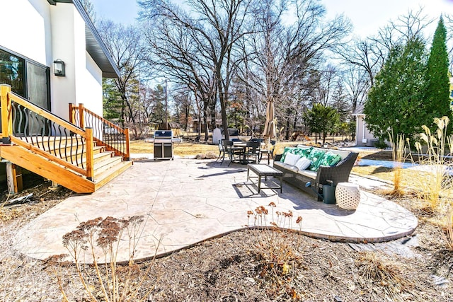 view of patio with grilling area and an outdoor hangout area