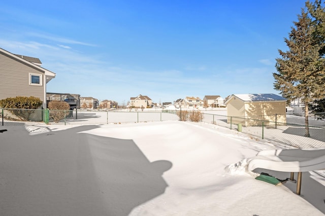 view of yard featuring fence and a residential view