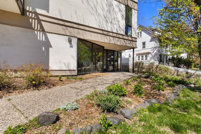 exterior space featuring stucco siding