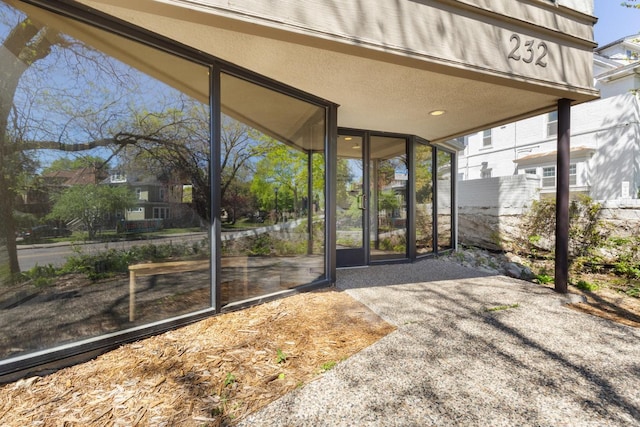 unfurnished sunroom featuring healthy amount of natural light