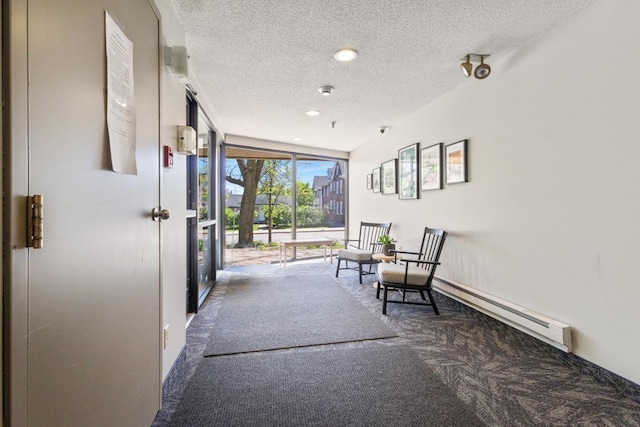 building lobby with a textured ceiling and recessed lighting