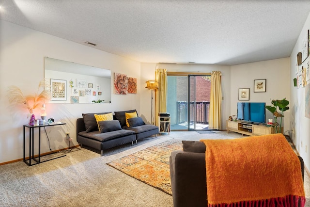 carpeted living room with a textured ceiling