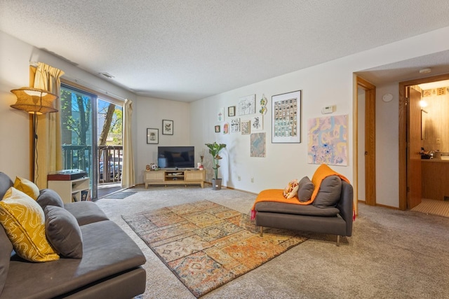 carpeted living room featuring a textured ceiling