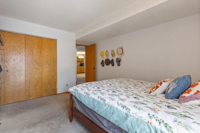 bedroom with light colored carpet and a closet