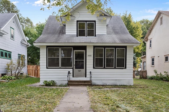 bungalow with a front lawn