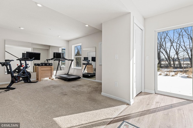 workout area featuring recessed lighting and baseboards