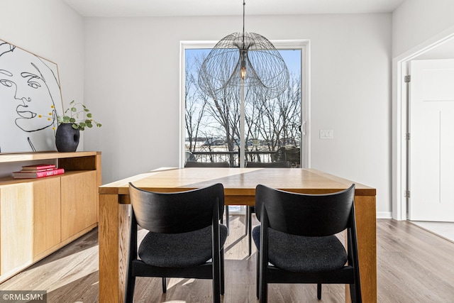 dining room with light wood-style flooring