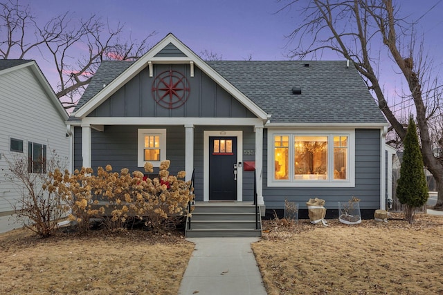 view of front of property with a porch, a shingled roof, and board and batten siding