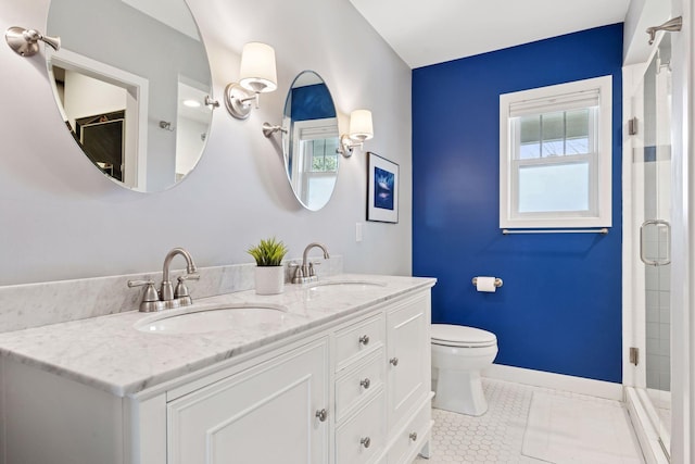 full bathroom with a stall shower, a sink, toilet, and tile patterned floors