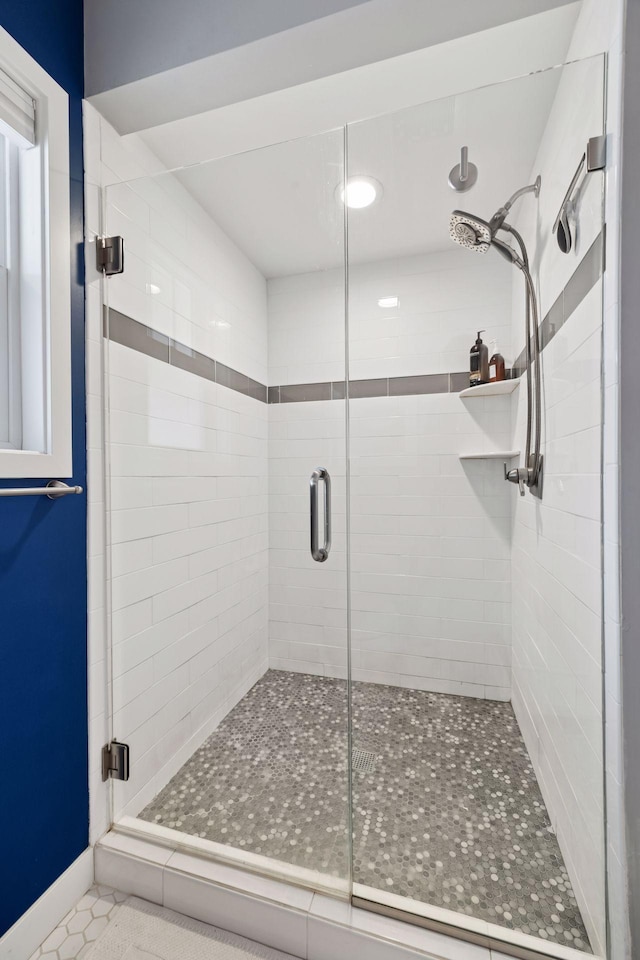 full bathroom featuring a stall shower