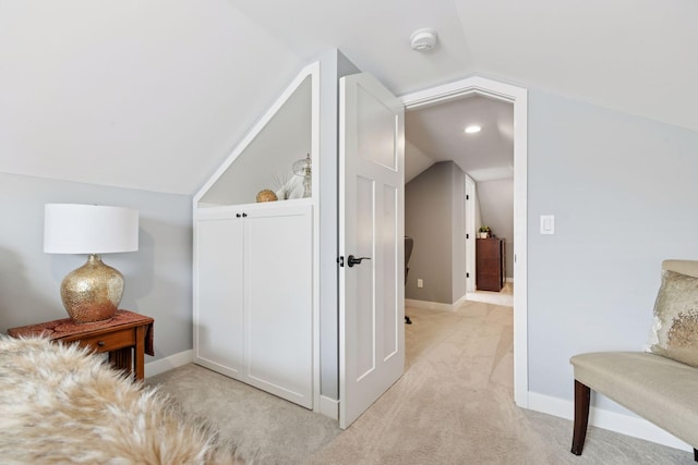 sitting room with light carpet, baseboards, vaulted ceiling, and recessed lighting