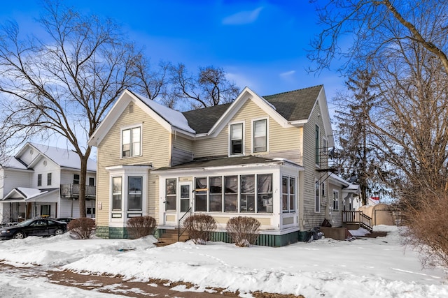 view of front of property with a sunroom