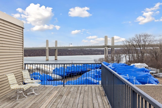 6213 Saint Croix Trl N Unit 102, Oak Park Heights, MN 55082 - wooden terrace with a pool and a water view