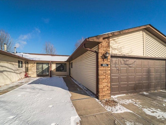 view of property exterior featuring a garage