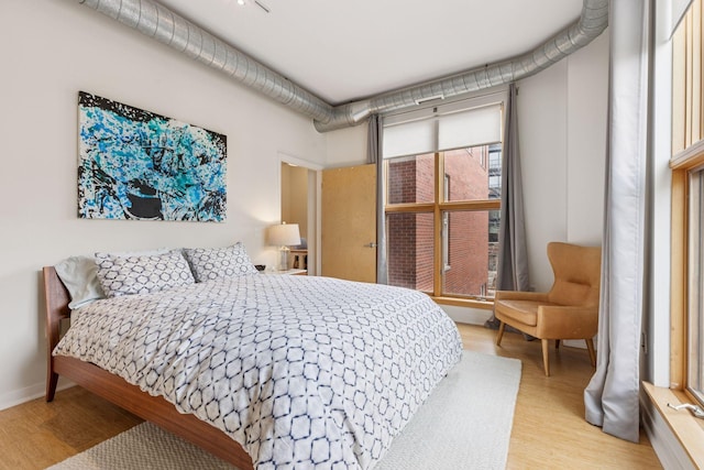 bedroom featuring wood finished floors