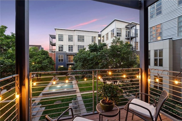 view of balcony at dusk