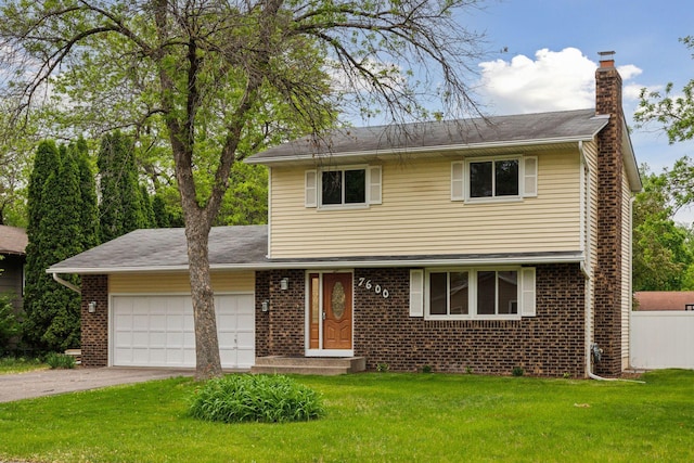 view of front of house featuring asphalt driveway, an attached garage, a chimney, and brick siding