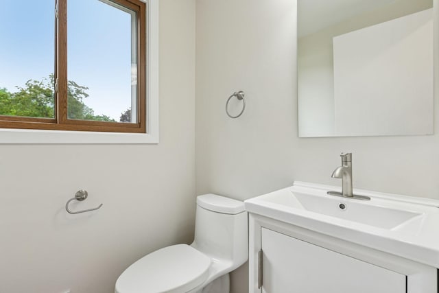 half bath with toilet and vanity