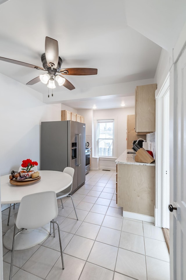 351 Morse Ave, Excelsior, MN 55331 - kitchen featuring light brown cabinetry, high end refrigerator, light countertops, light tile patterned floors, and ceiling fan