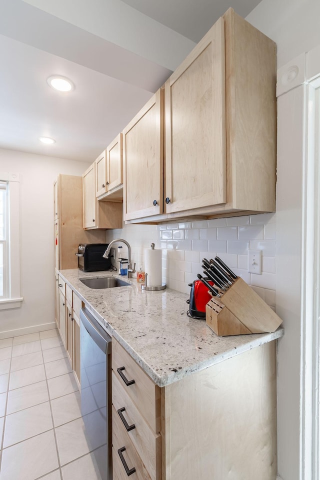 351 Morse Ave, Excelsior, MN 55331 - kitchen with a sink, stainless steel dishwasher, light brown cabinetry, light tile patterned floors, and tasteful backsplash