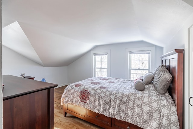 351 Morse Ave, Excelsior, MN 55331 - bedroom with vaulted ceiling, wood finished floors, and baseboards