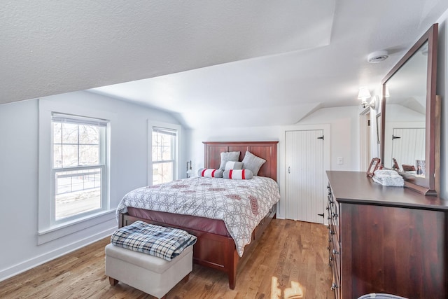 351 Morse Ave, Excelsior, MN 55331 - bedroom with vaulted ceiling, light wood-type flooring, and baseboards