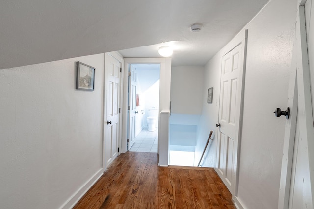 351 Morse Ave, Excelsior, MN 55331 - corridor featuring an upstairs landing, wood finished floors, and baseboards