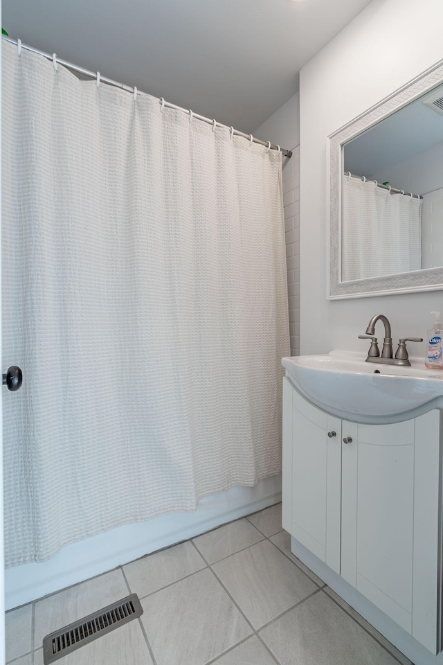 351 Morse Ave, Excelsior, MN 55331 - full bathroom with tile patterned floors, shower / bath combination with curtain, and vanity