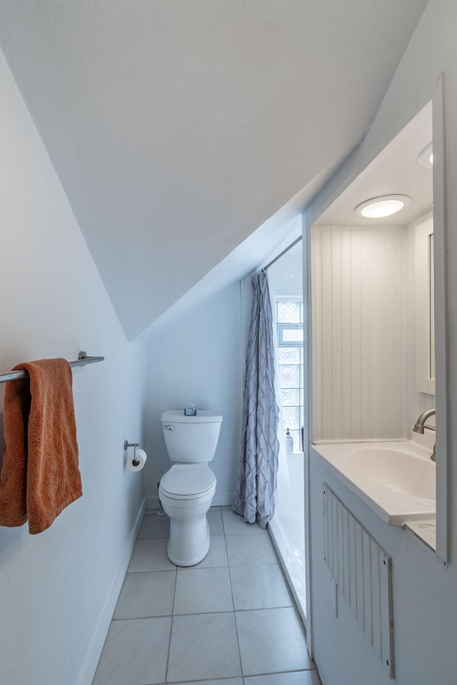 351 Morse Ave, Excelsior, MN 55331 - bathroom with a shower with shower curtain, toilet, tile patterned flooring, vanity, and vaulted ceiling