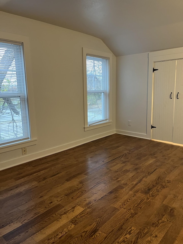 351 Morse Ave, Excelsior, MN 55331 - additional living space with lofted ceiling, dark wood finished floors, and baseboards