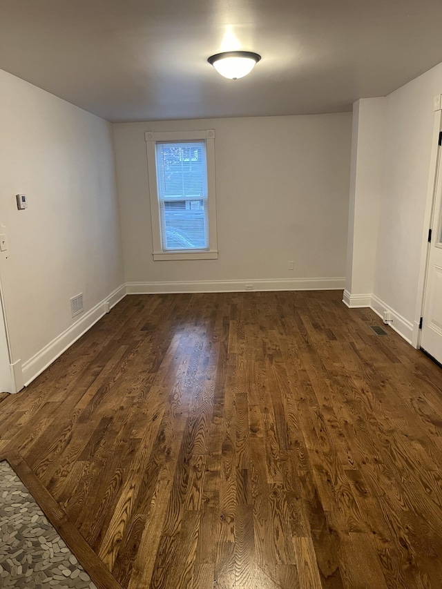 351 Morse Ave, Excelsior, MN 55331 - empty room with dark wood-style flooring and baseboards