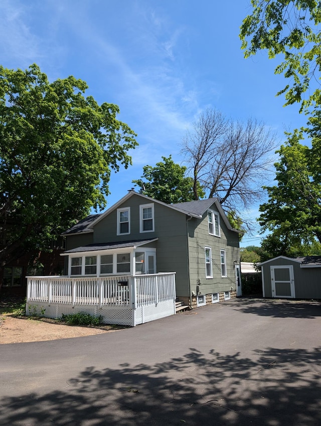 351 Morse Ave, Excelsior, MN 55331 - view of front facade with a shed, an outdoor structure, and driveway