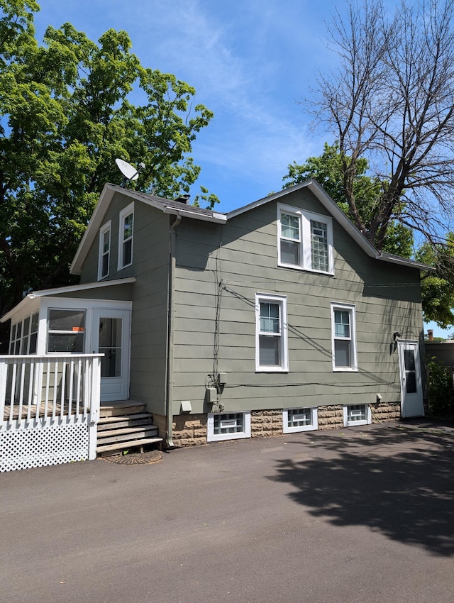 351 Morse Ave, Excelsior, MN 55331 - view of property exterior featuring a sunroom