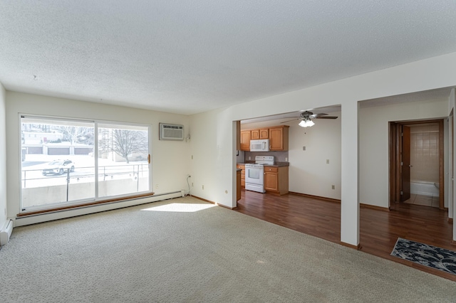 unfurnished living room featuring dark colored carpet, a baseboard heating unit, ceiling fan, a wall mounted air conditioner, and a textured ceiling