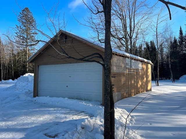 view of snow covered garage