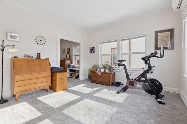 exercise room featuring baseboards, an AC wall unit, ornamental molding, and light colored carpet