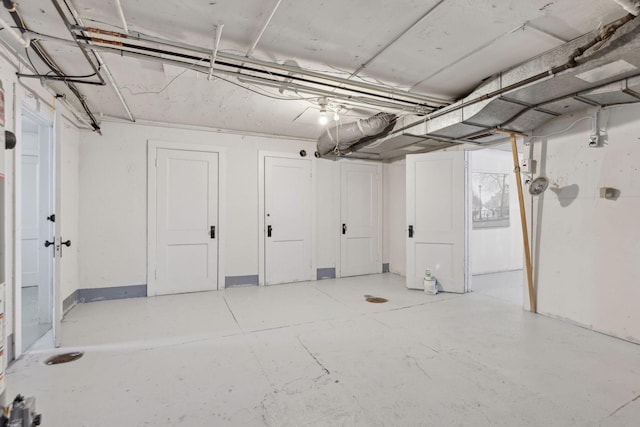 unfinished basement featuring baseboards