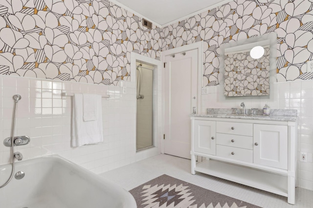 1625 25th St, Minneapolis, MN 55405 - full bathroom with a tub, a shower with door, wallpapered walls, vanity, and crown molding