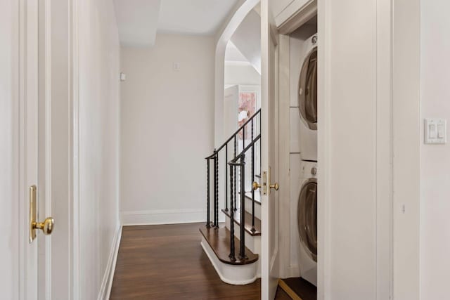 1625 25th St, Minneapolis, MN 55405 - washroom with stacked washer / drying machine, dark wood finished floors, and baseboards