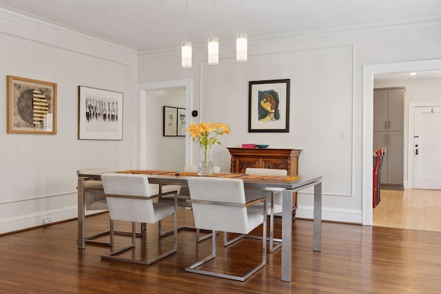 1625 25th St, Minneapolis, MN 55405 - dining area featuring wood finished floors, ornamental molding, and baseboards