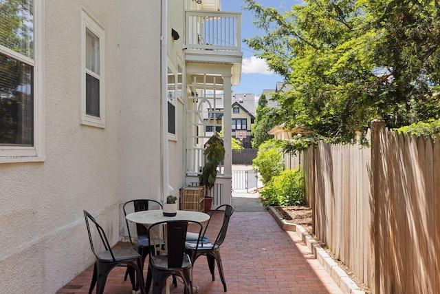 1625 25th St, Minneapolis, MN 55405 - view of patio / terrace with outdoor dining space and a balcony