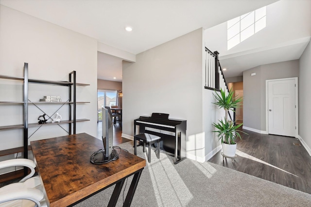 home office with dark wood-type flooring