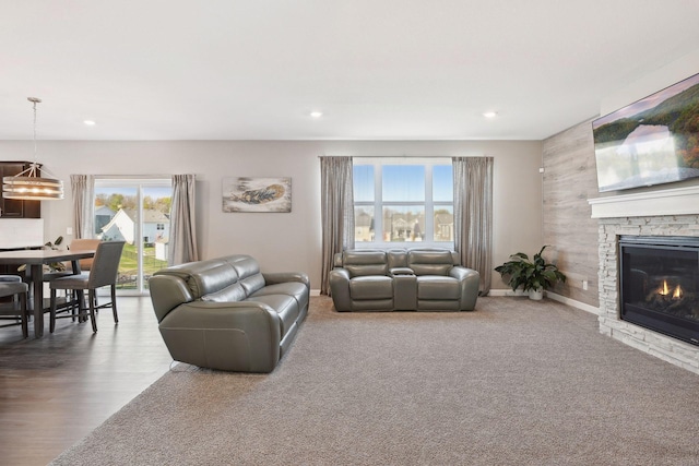 carpeted living room featuring a fireplace