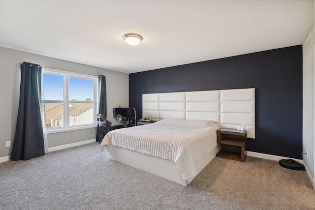 carpeted bedroom with a textured ceiling