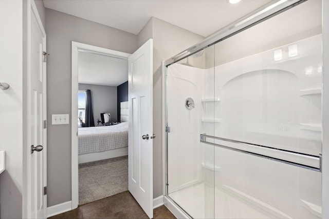 bathroom featuring a shower with shower door