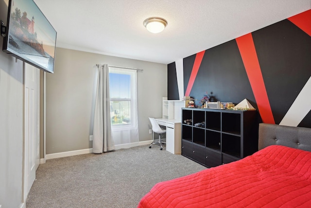 carpeted bedroom featuring a textured ceiling