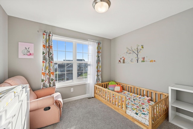 bedroom with carpet and a nursery area