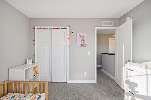 carpeted bedroom with a closet